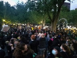 Thousands gather at the Boston Commons in the evening for a BLM protest. The crowd stretches beyond sight. 